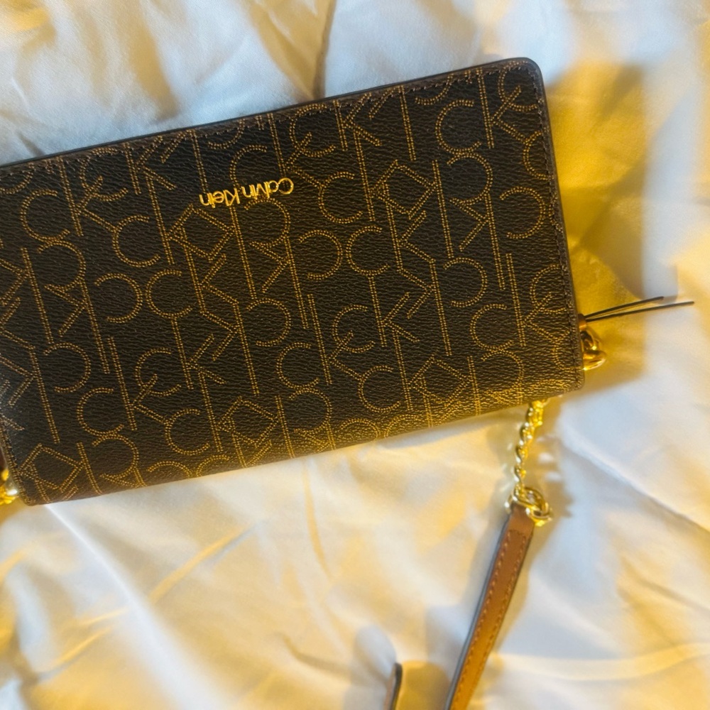 Calvin Klein Black and Gold Logo Wristlet